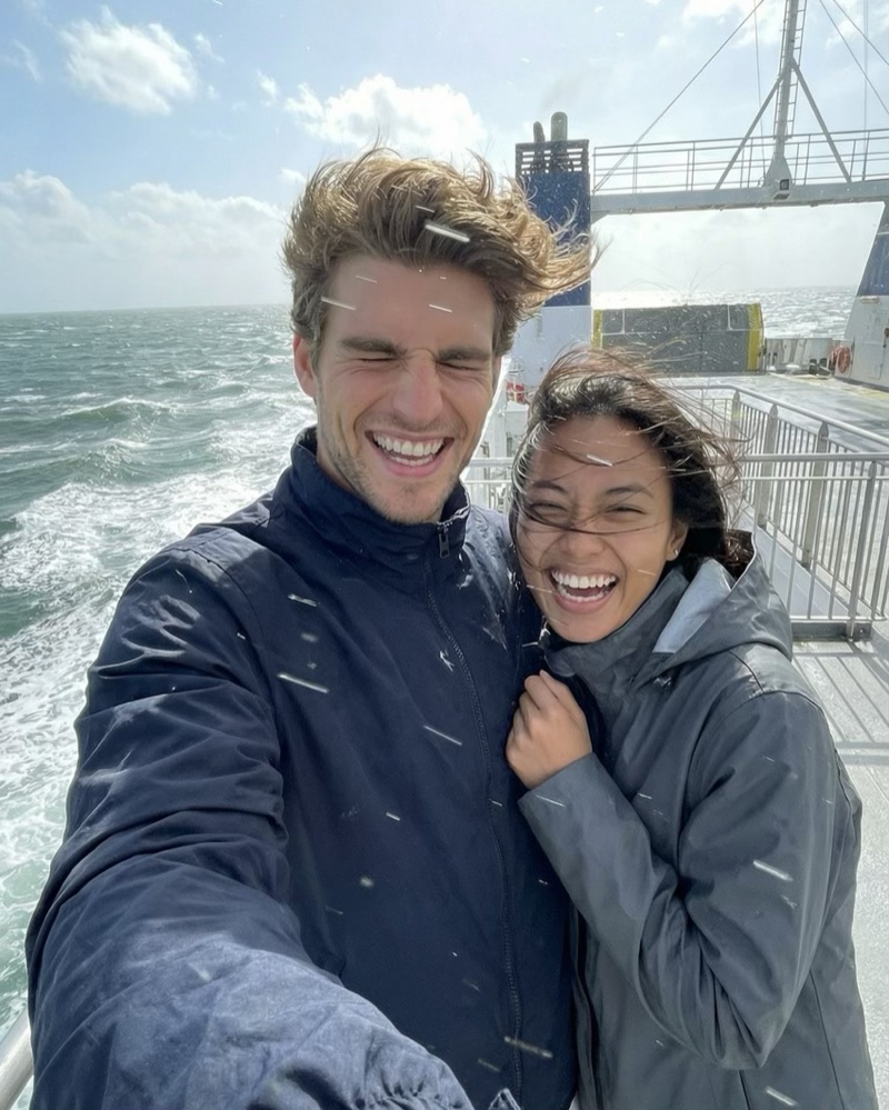 Riley and Paula laughing together on a ferry crossing